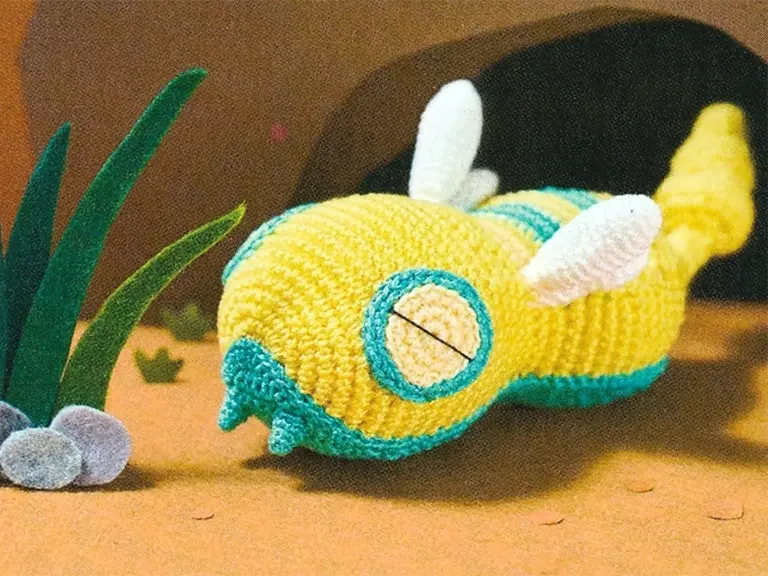 A crocheted Dunsparce used as an example of a distinctive Pokémon art style